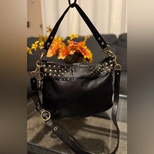 Coach Zoe handbag, studded leather shoulder bag or hobo silhouette.